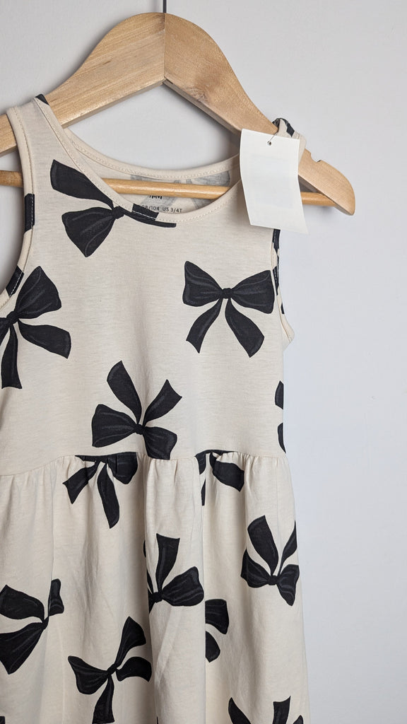 NWT's H&M Cream Bow Dress - Girls 2-4 Years Little Ones Preloved Used, Preloved, Preworn & Second Hand Baby, Kids & Children's Clothing UK Online. Cheap affordable. Brands including Next, Joules, Nutmeg Morrisons, TU, F&F, H&M.