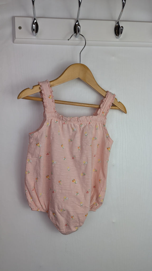 Primark Apricot Floral Romper - Baby Girls 6-9 Months Little Ones Preloved Used, Preloved, Preworn Baby, Girls & Boys Clothes. Kids & Children's second hand Clothing UK Online. Cheap affordable. Brands including Next, Joules, Nutmeg Morrisons, TU, F&F, H&M.